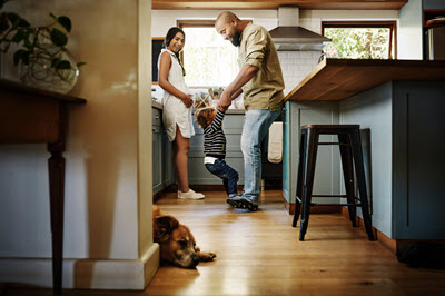 image of young family in their kitchen.