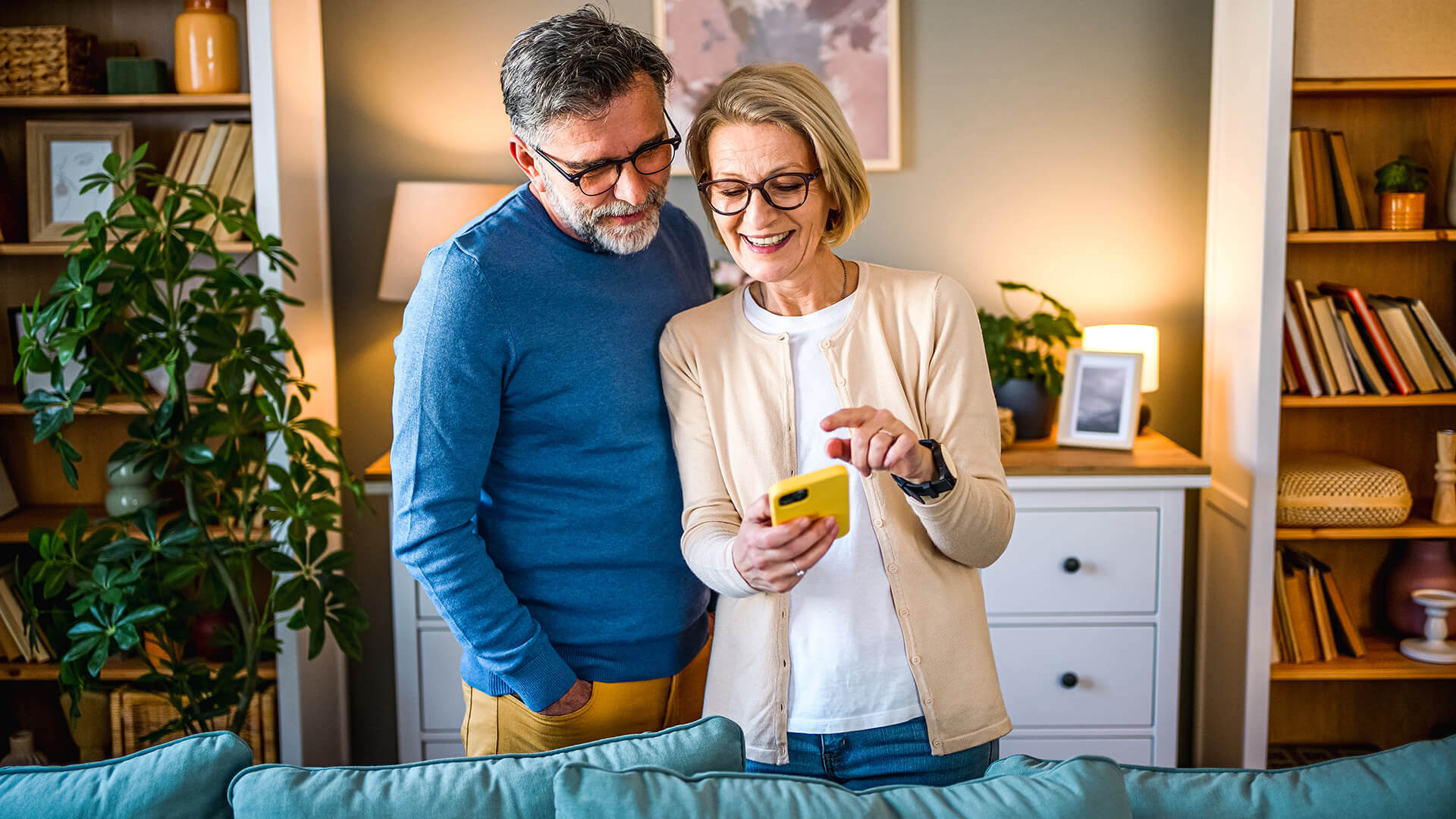 Mature couple using mobile phone
